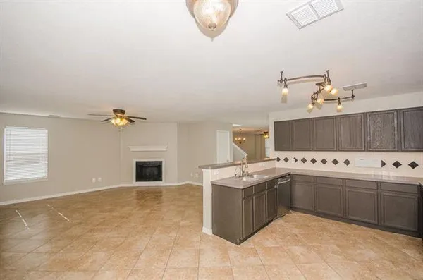 a kitchen with stainless steel appliances granite countertop a sink and a stove
