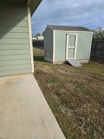 a view of a backyard of a house