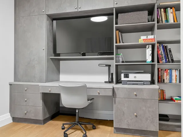 a view of cabinets and wooden floor