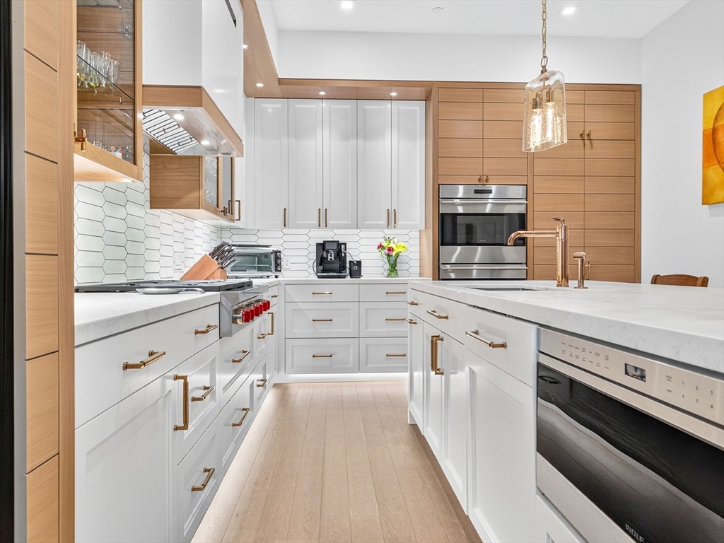 45 Temple Street, Unit 408 Boston, MA 02114 - Photo 2 of 36 a kitchen with stainless steel appliances a sink stove and cabinets