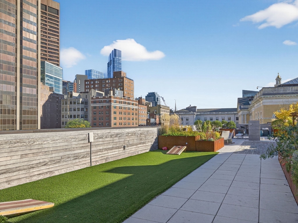 45 Temple Street, Unit 408 Boston, MA 02114 - Photo 26 of 36 a view of a terrace with outdoor seating and city view