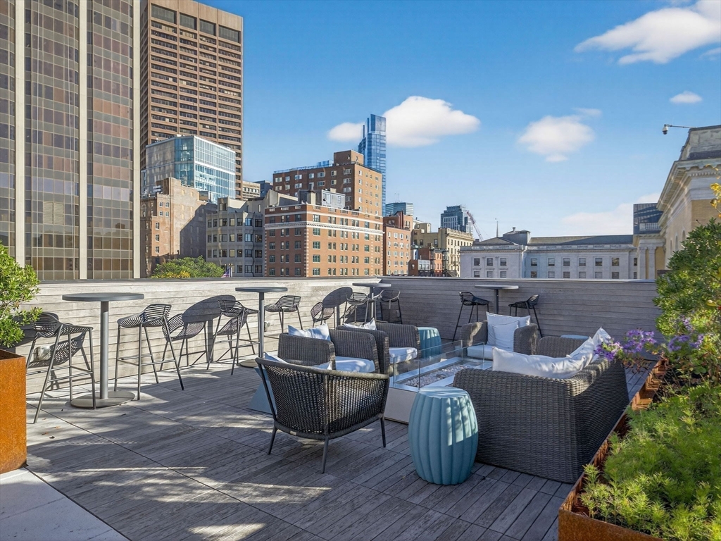 45 Temple Street, Unit 408 Boston, MA 02114 - Photo 28 of 36 a roof deck with patio and garden