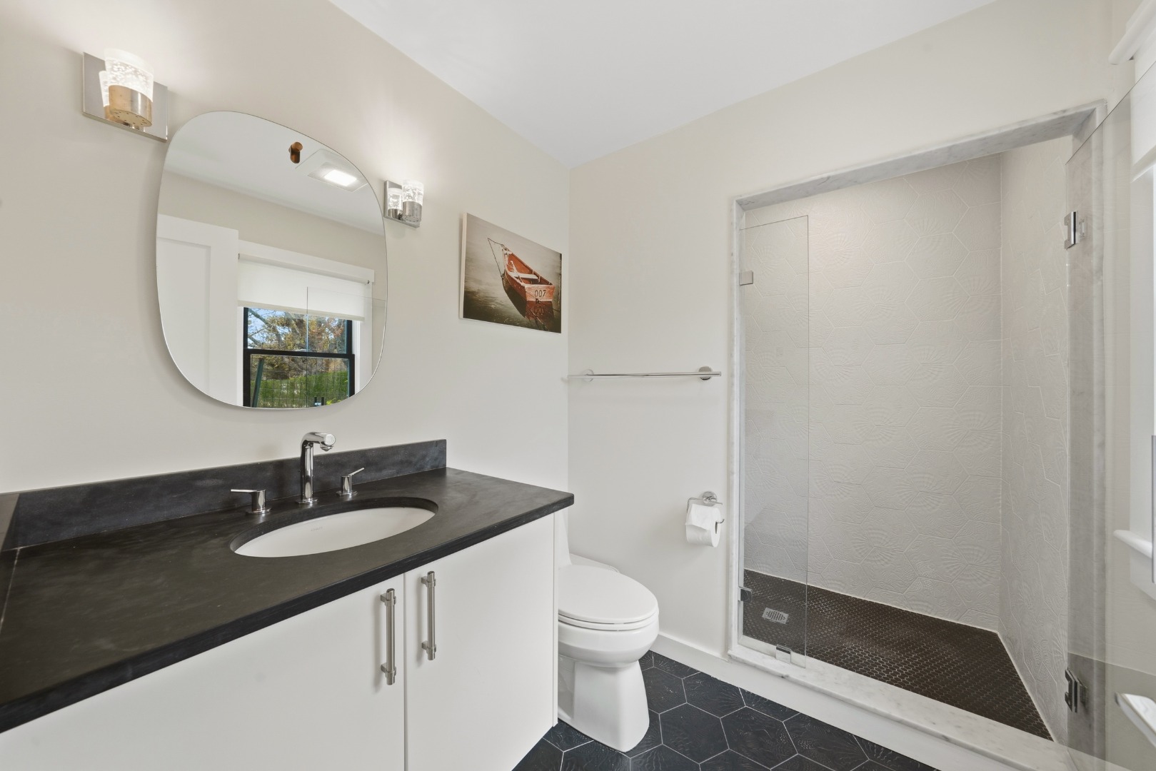247 Polpis Road Nantucket, MA 02554 - Photo 31 of 52 a bathroom with a sink a toilet a mirror and shower