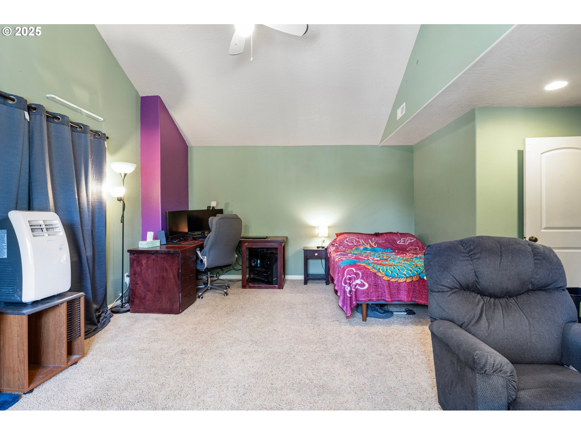 952 South 69th Street Springfield, OR 97478 - Photo 22 of 25 a bedroom with furniture and a flat screen tv
