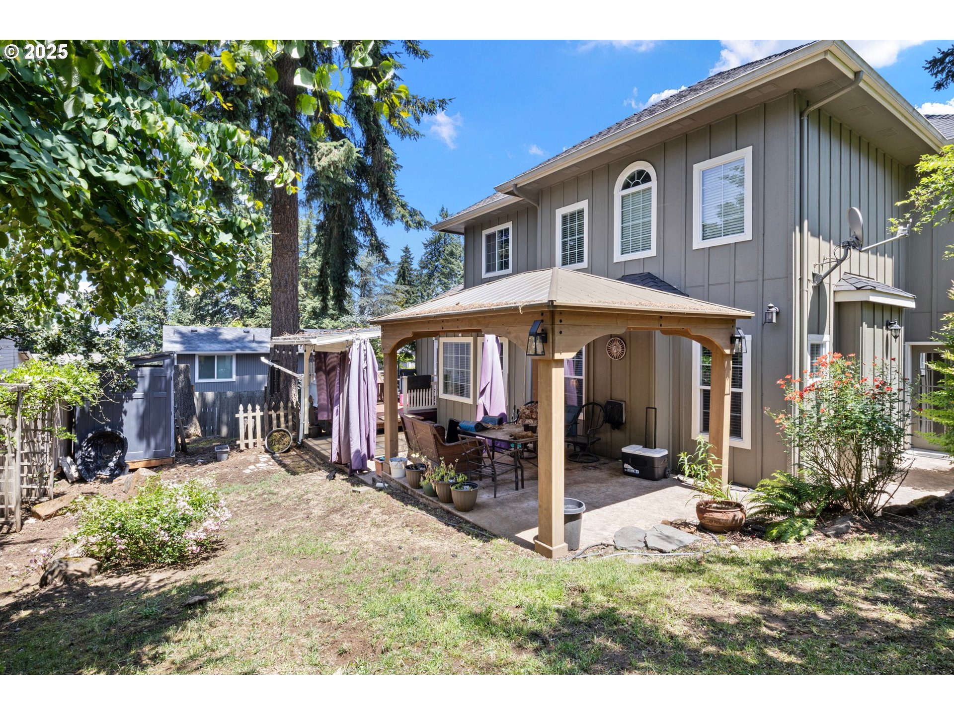 952 South 69th Street Springfield, OR 97478 - Photo 23 of 25 a view of a house with a yard and potted plants
