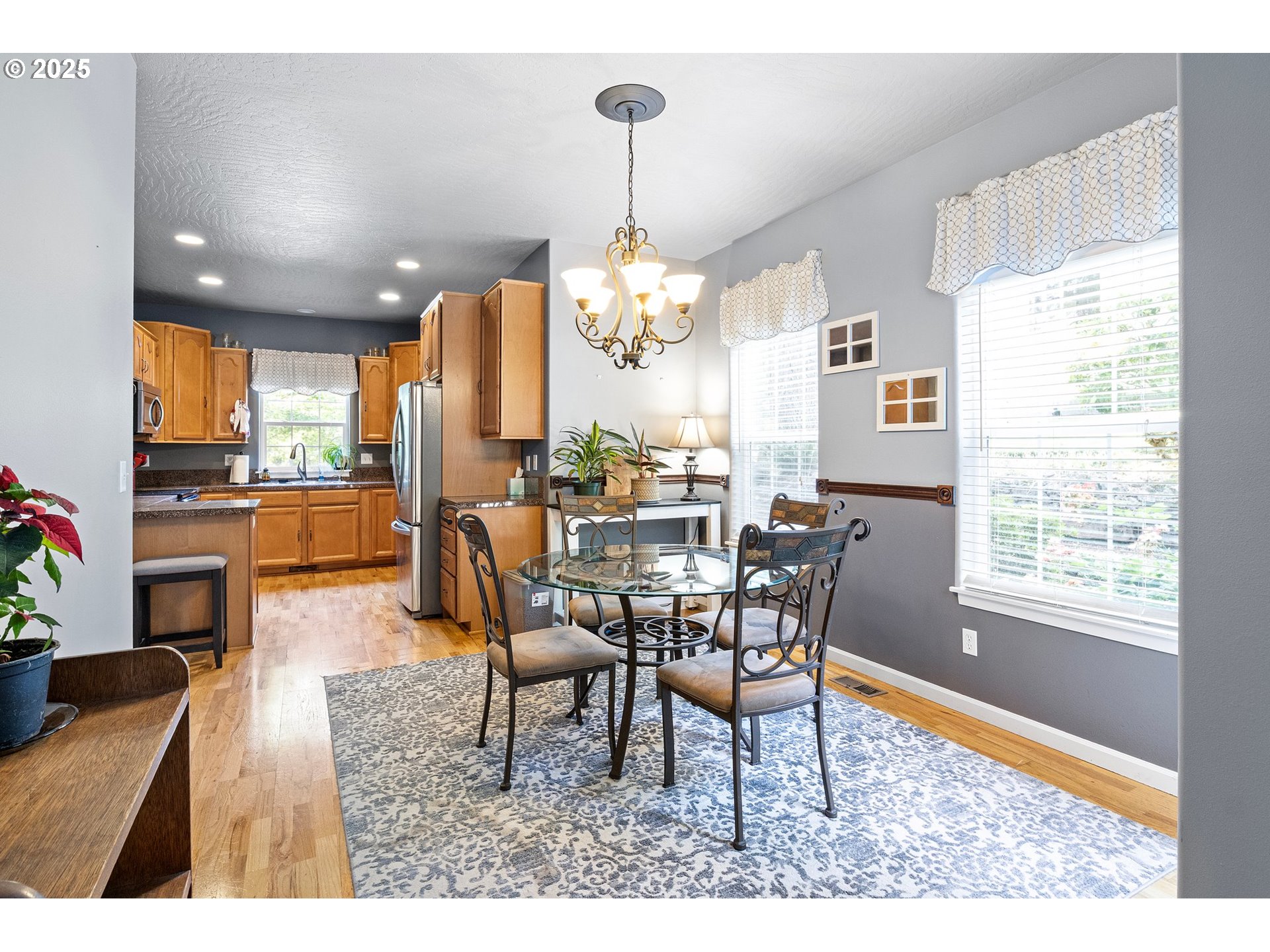 952 South 69th Street Springfield, OR 97478 - Photo 6 of 25 a dining room filled chandelier and wooden furniture