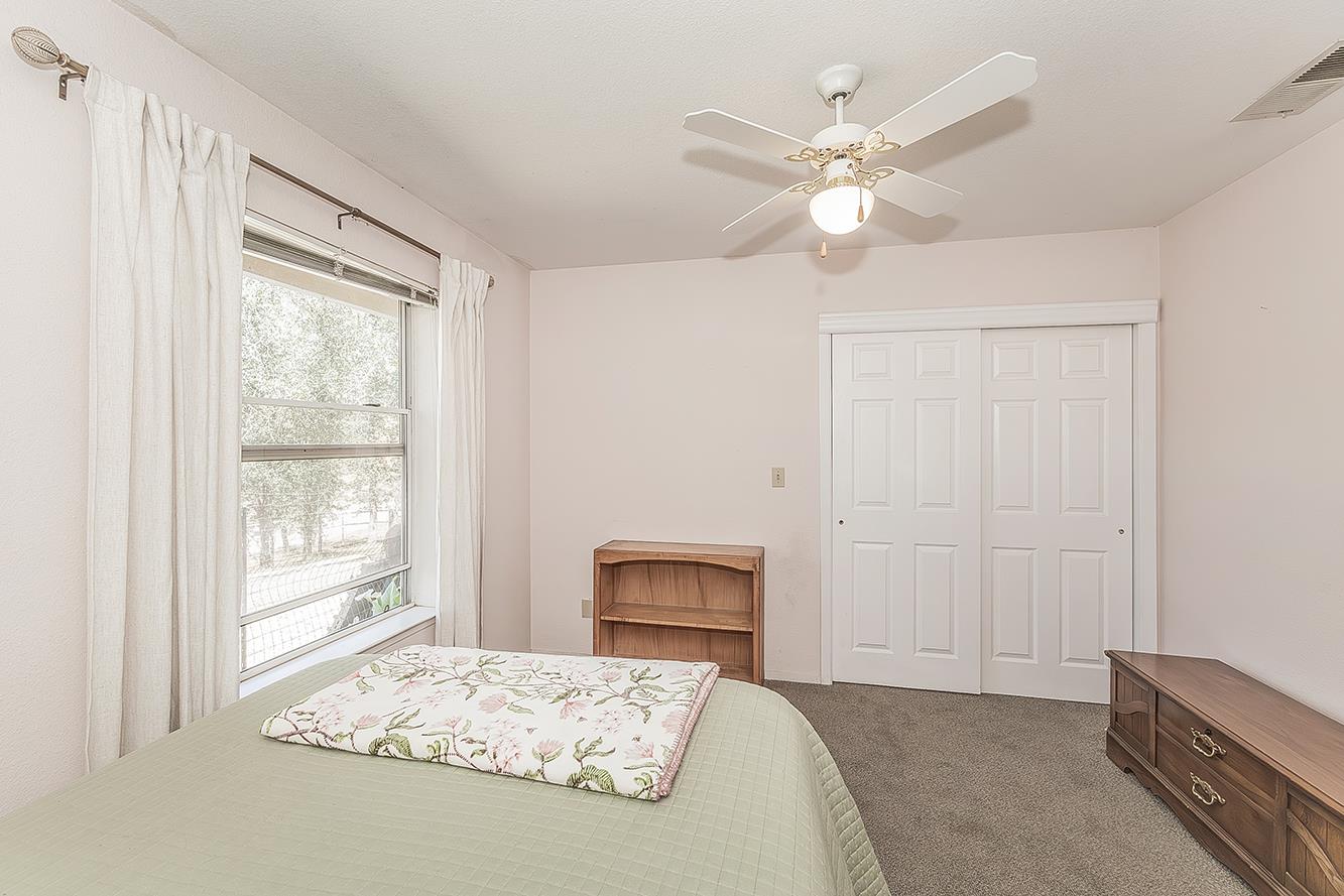 14815 Garlock Lane Prather, CA 93651 - Photo 26 of 80 a bedroom with a bed and a window