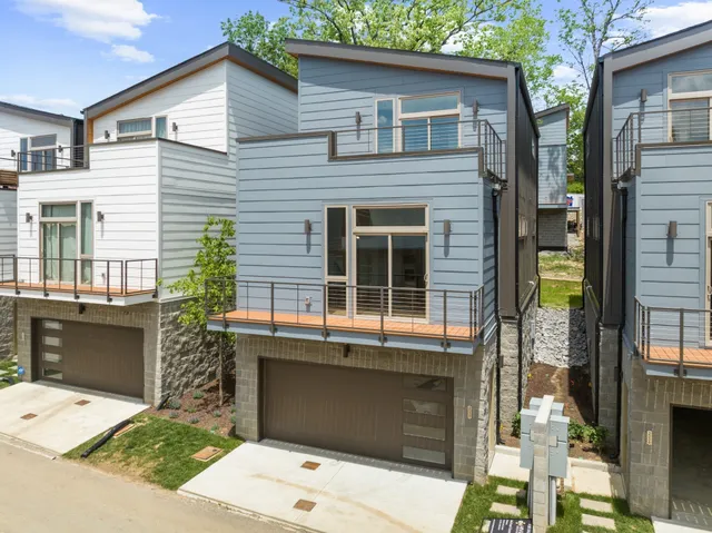 a front view of a house with a garage