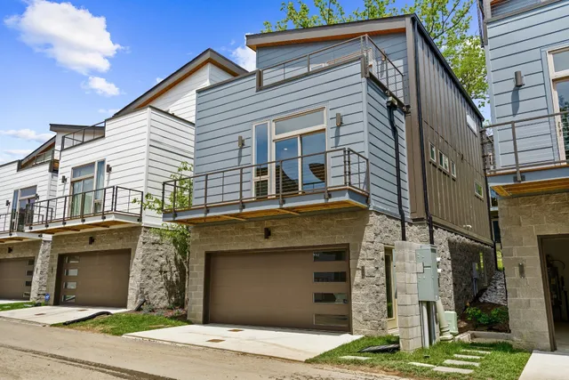a front view of a house with garage