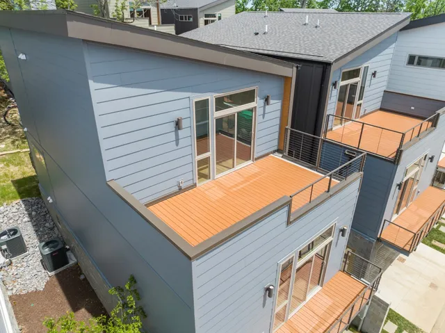 a view of a patio with a table and chairs