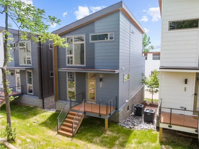 a view of house with swimming pool and porch