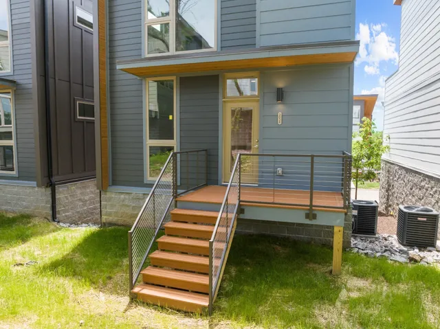 a view of front door of house with stairs