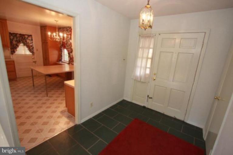 1313 Gresham Road Silver Spring, MD 20904 - Photo 12 of 28 a view of empty room with wooden floor and fan