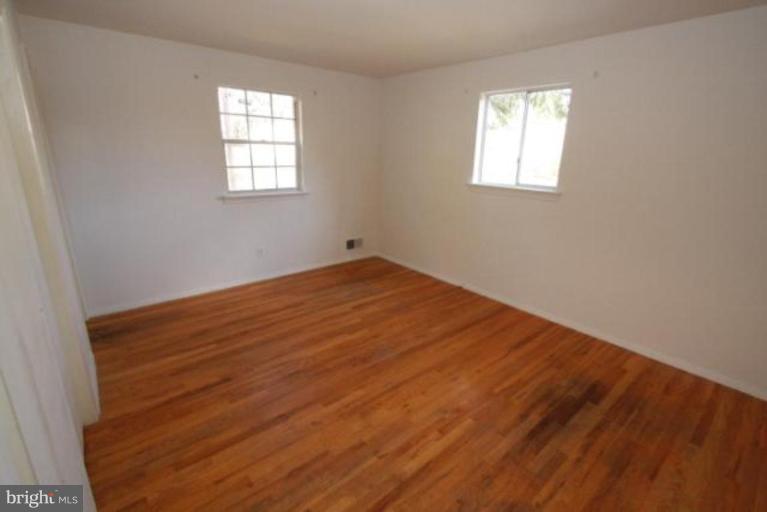1313 Gresham Road Silver Spring, MD 20904 - Photo 28 of 28 a view of empty room with wooden floor and fan