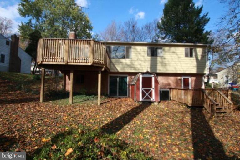 1313 Gresham Road Silver Spring, MD 20904 - Photo 10 of 28 a view of a house with a wooden fence