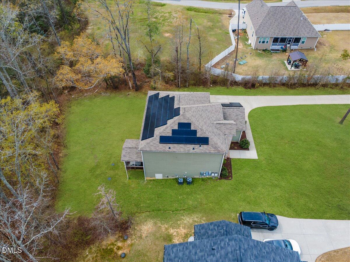 7804 Charters End Street Willow Spring, NC 27592 - Photo 40 of 43 a view of a garden with lawn chairs