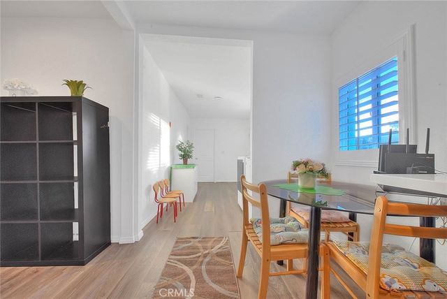 a view of a dining room with furniture and window