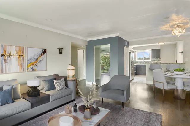 a living room with furniture and a table