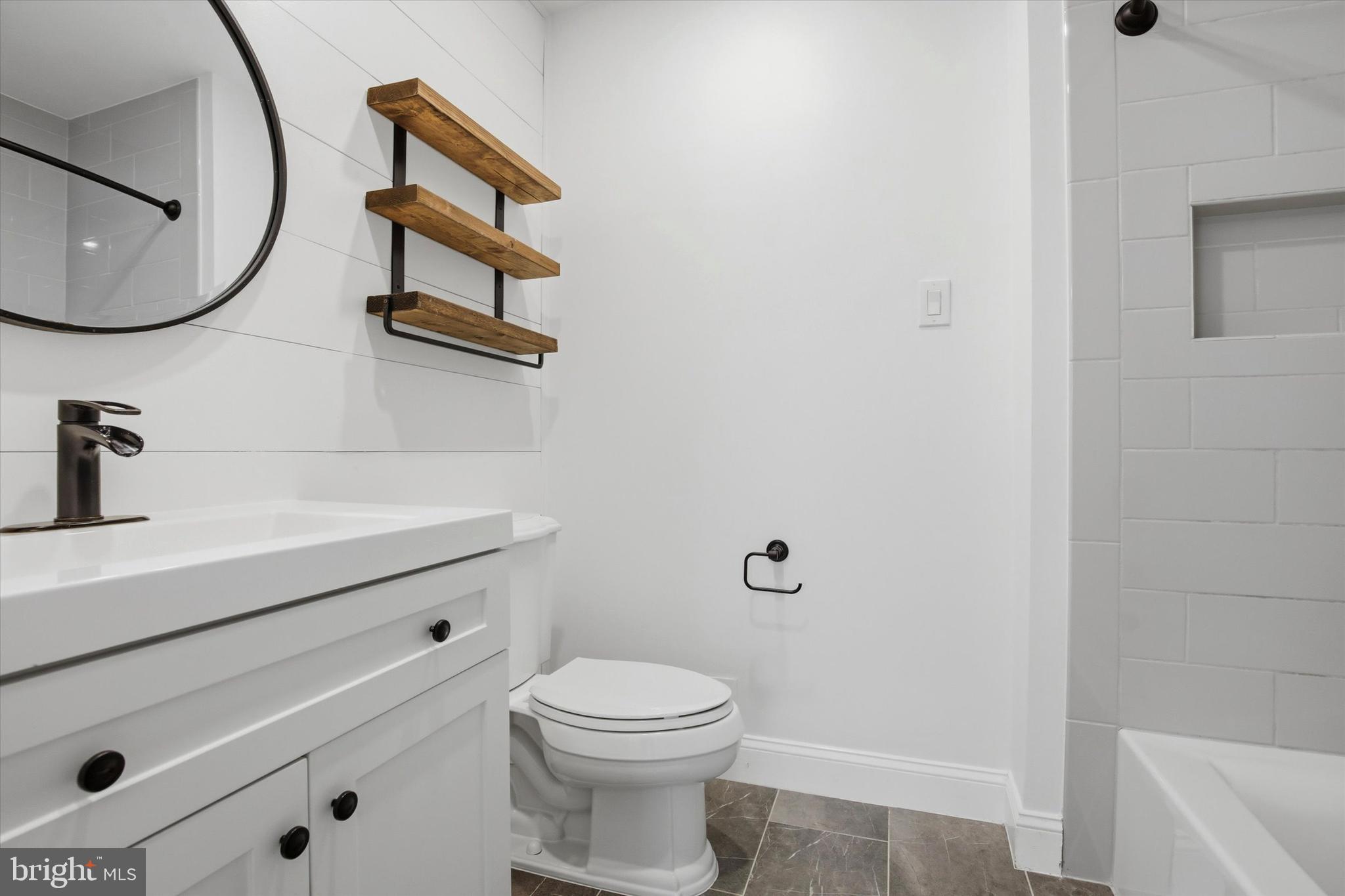 3 Windsor Circle Chesterbrook, PA 19087 - Photo 15 of 29 a bathroom with a toilet a sink and mirror