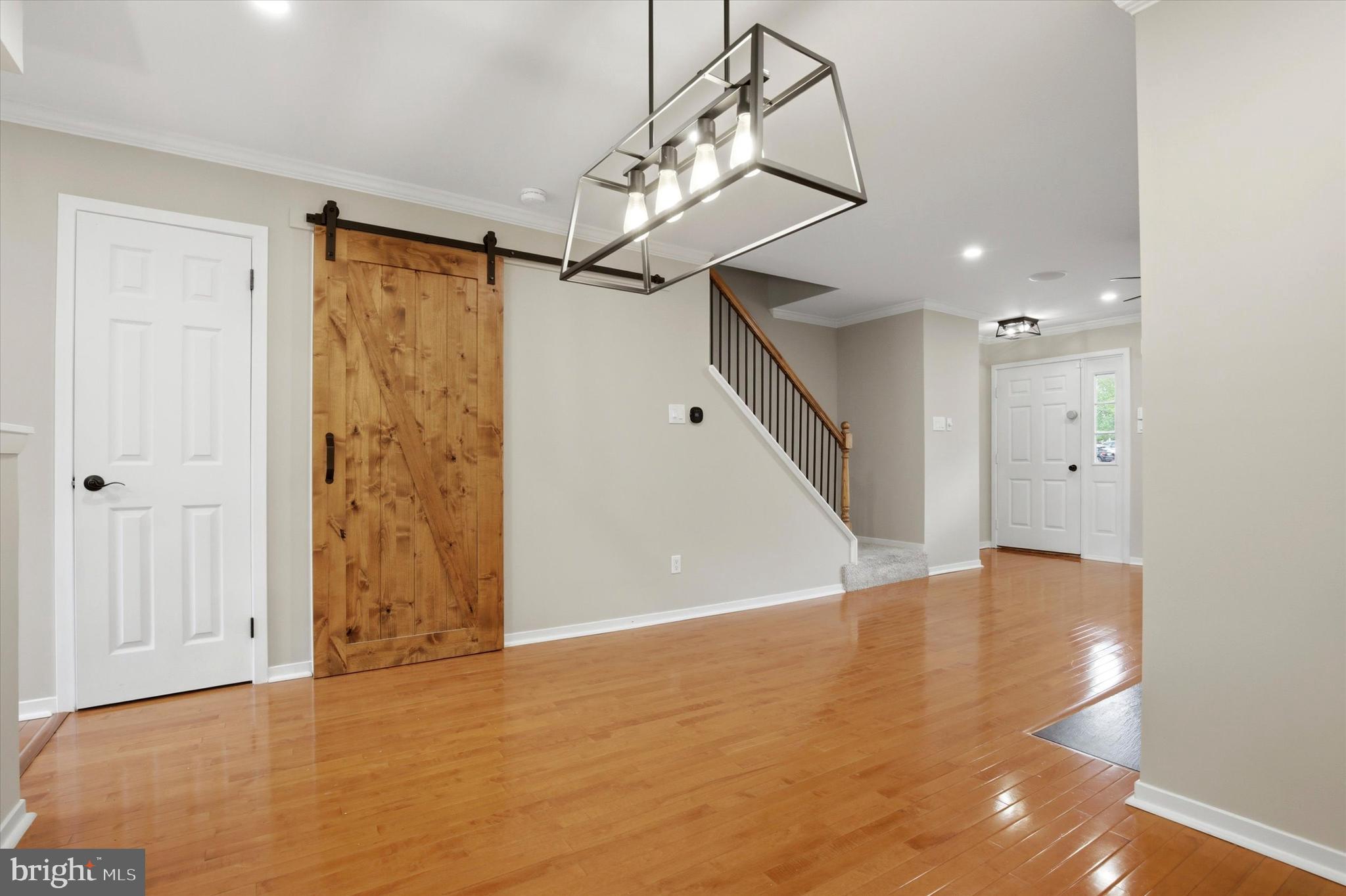 3 Windsor Circle Chesterbrook, PA 19087 - Photo 6 of 29 a view of an empty room with wooden floor and staircase