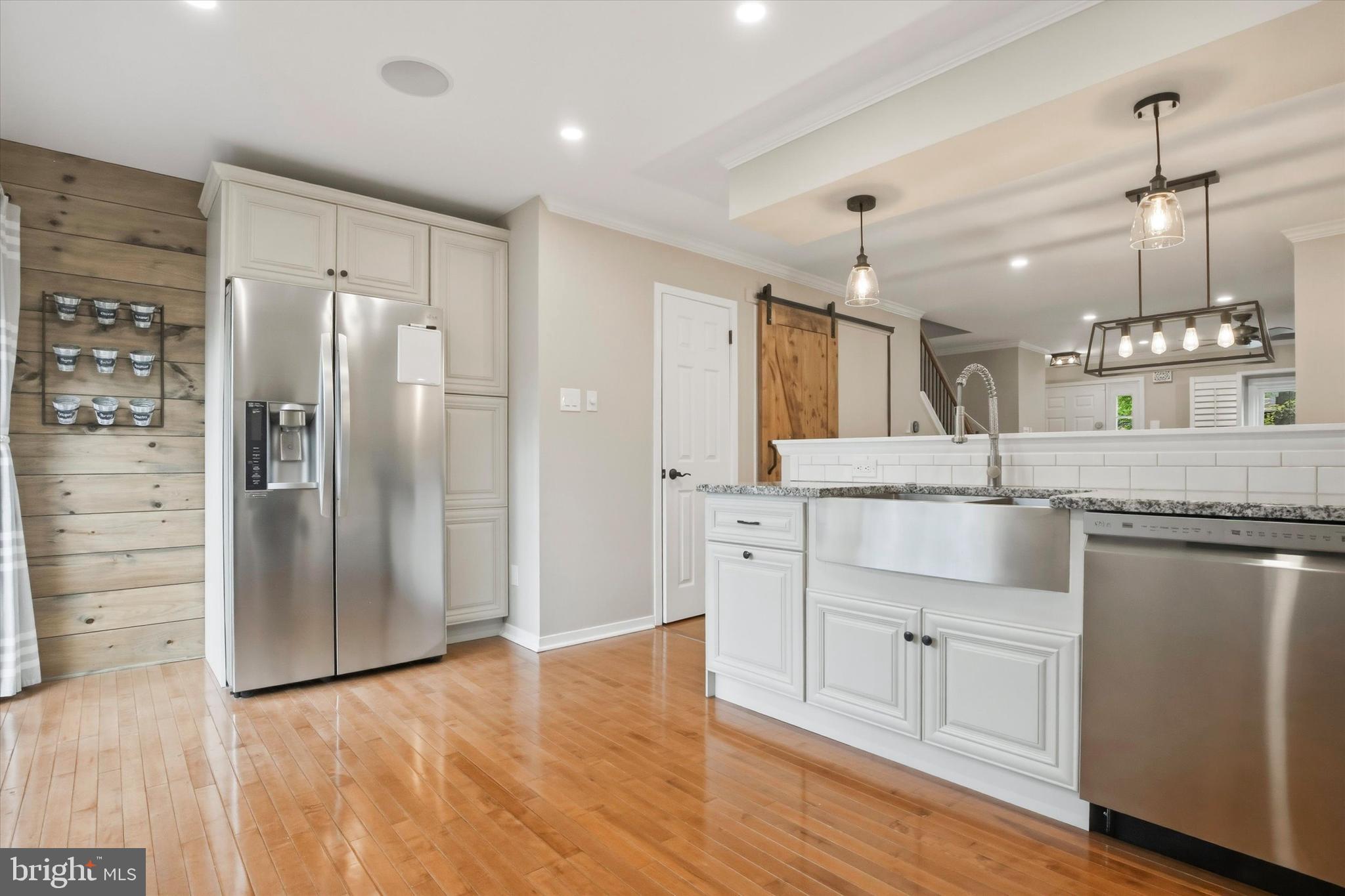 3 Windsor Circle Chesterbrook, PA 19087 - Photo 8 of 29 a large kitchen with stainless steel appliances kitchen island a refrigerator and cabinets
