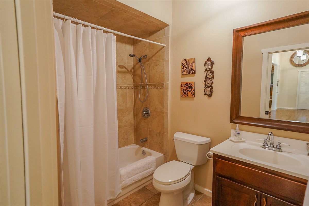 6410 Puupilo Road, Unit A1 Kapaa, HI 96746 - Photo 13 of 19 a bathroom with a sink a toilet and shower