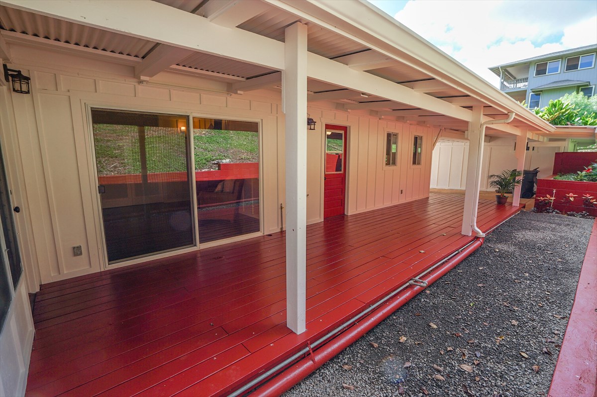6410 Puupilo Road, Unit A1 Kapaa, HI 96746 - Photo 16 of 19 a view of a porch with two chairs and a table