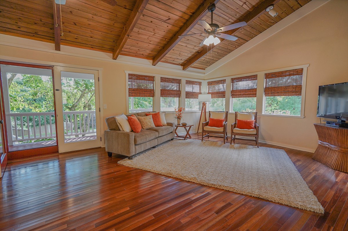 6410 Puupilo Road, Unit A1 Kapaa, HI 96746 - Photo 7 of 19 a living room with furniture and a large window