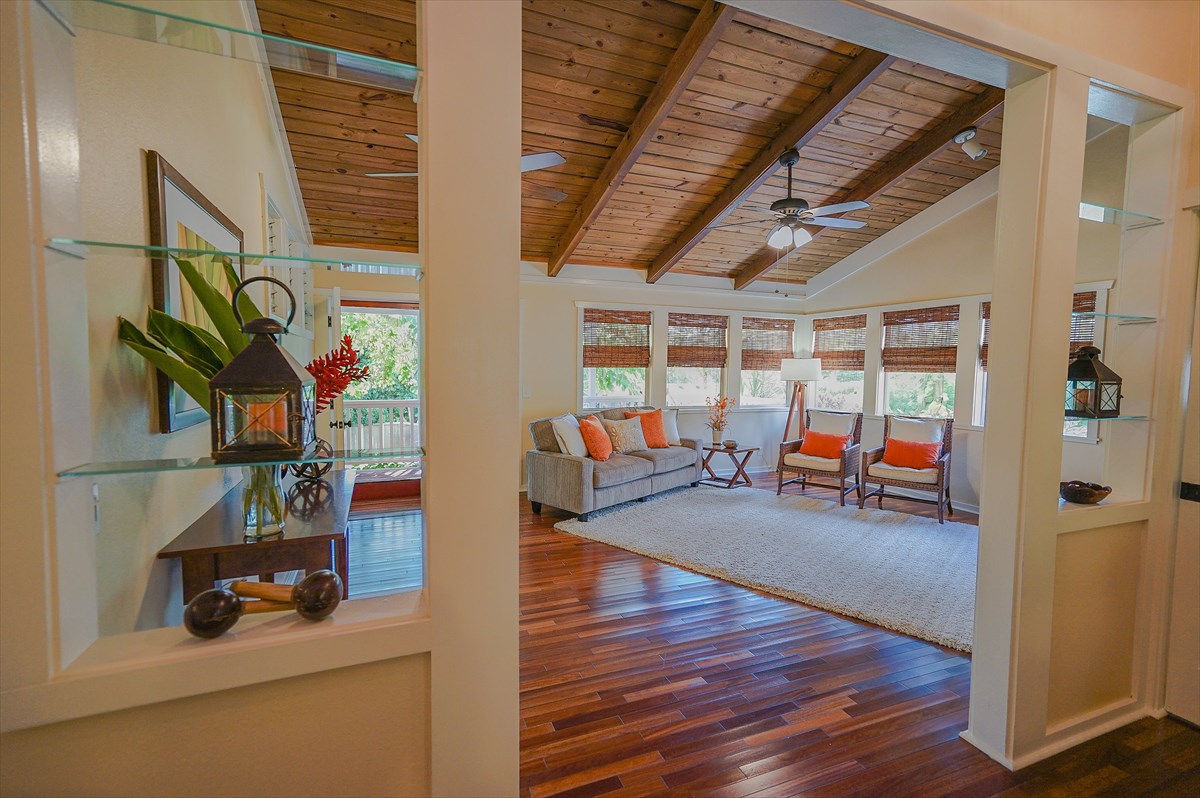6410 Puupilo Road, Unit A1 Kapaa, HI 96746 - Photo 8 of 19 a view of a room with wooden floor and windows