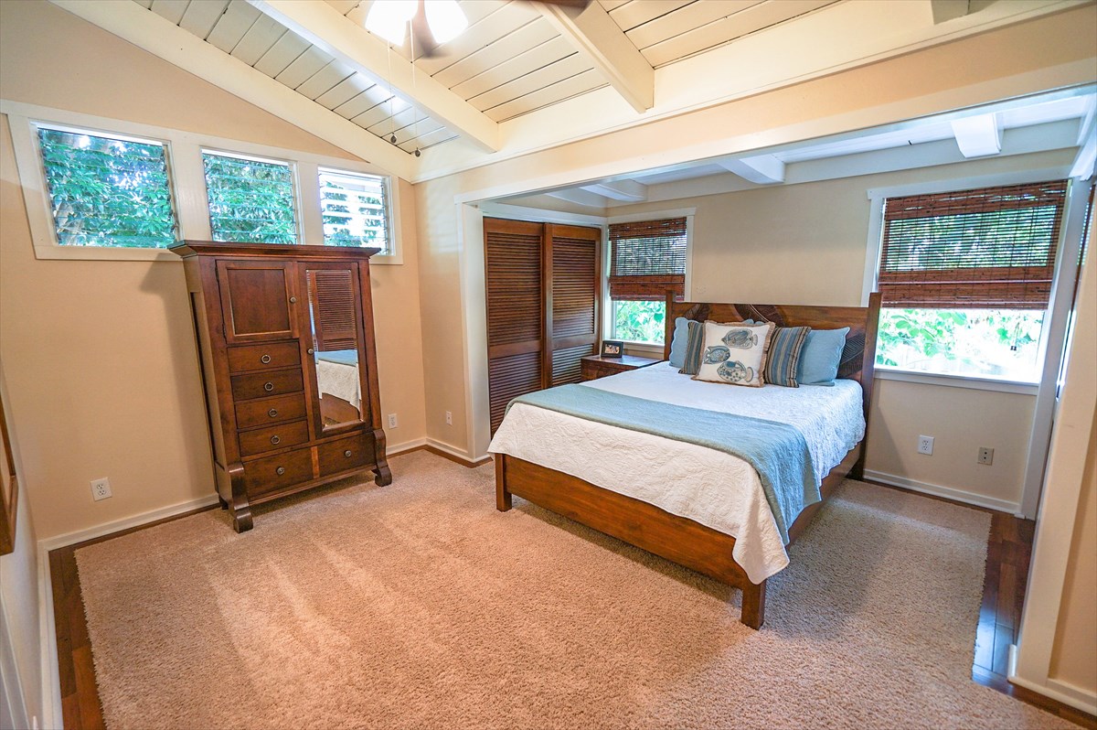 6410 Puupilo Road, Unit A1 Kapaa, HI 96746 - Photo 9 of 19 a bedroom with a bed and a window