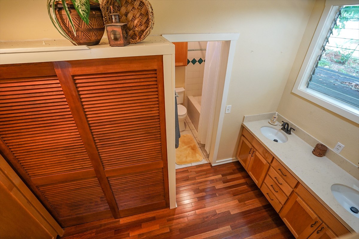 6410 Puupilo Road, Unit A1 Kapaa, HI 96746 - Photo 10 of 19 a bathroom with a sink a mirror and shower