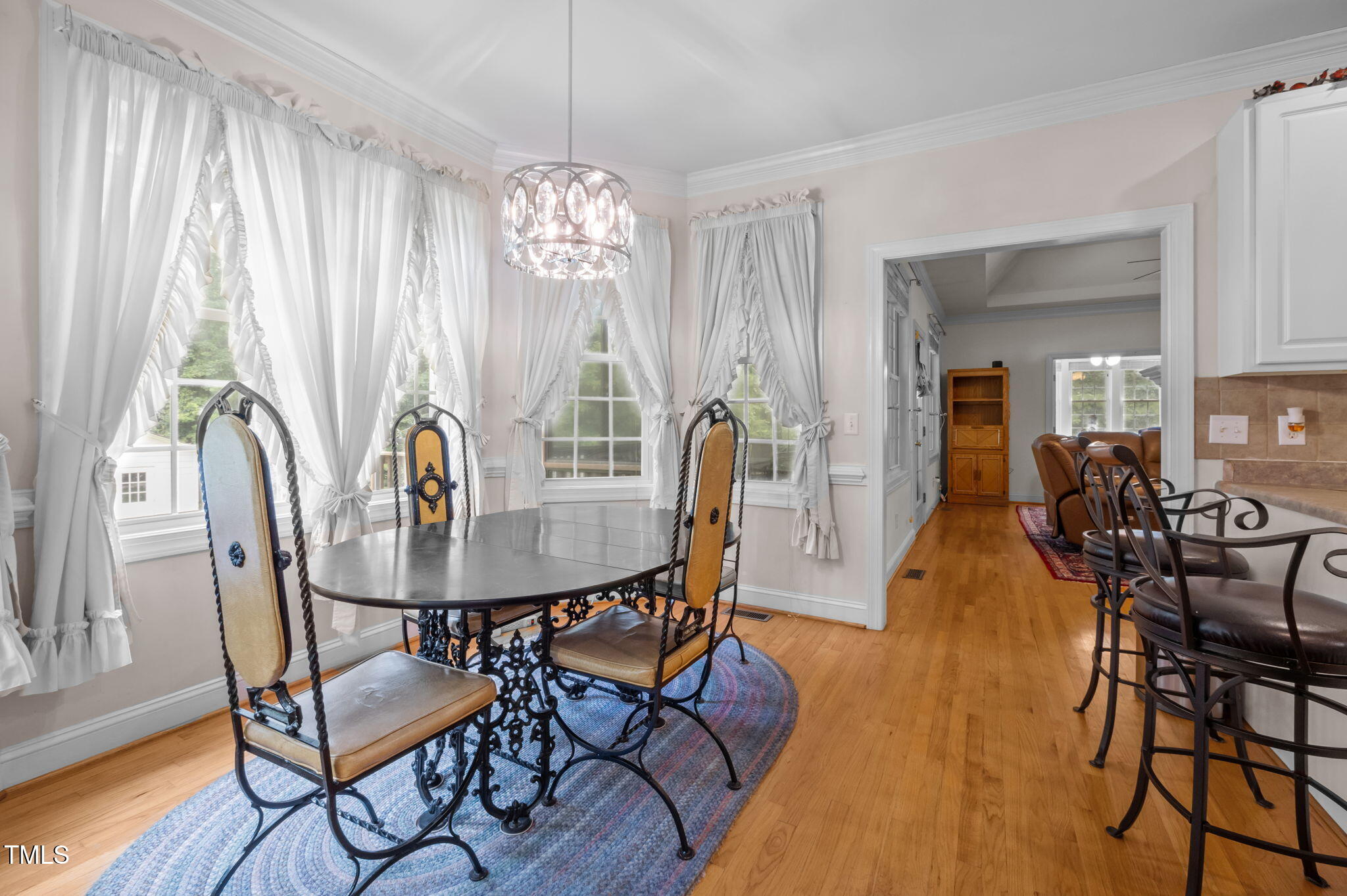 9 Piney Grove Road Bahama, NC 27503 - Photo 11 of 33 a view of a dining room with furniture wooden floor and chandelier