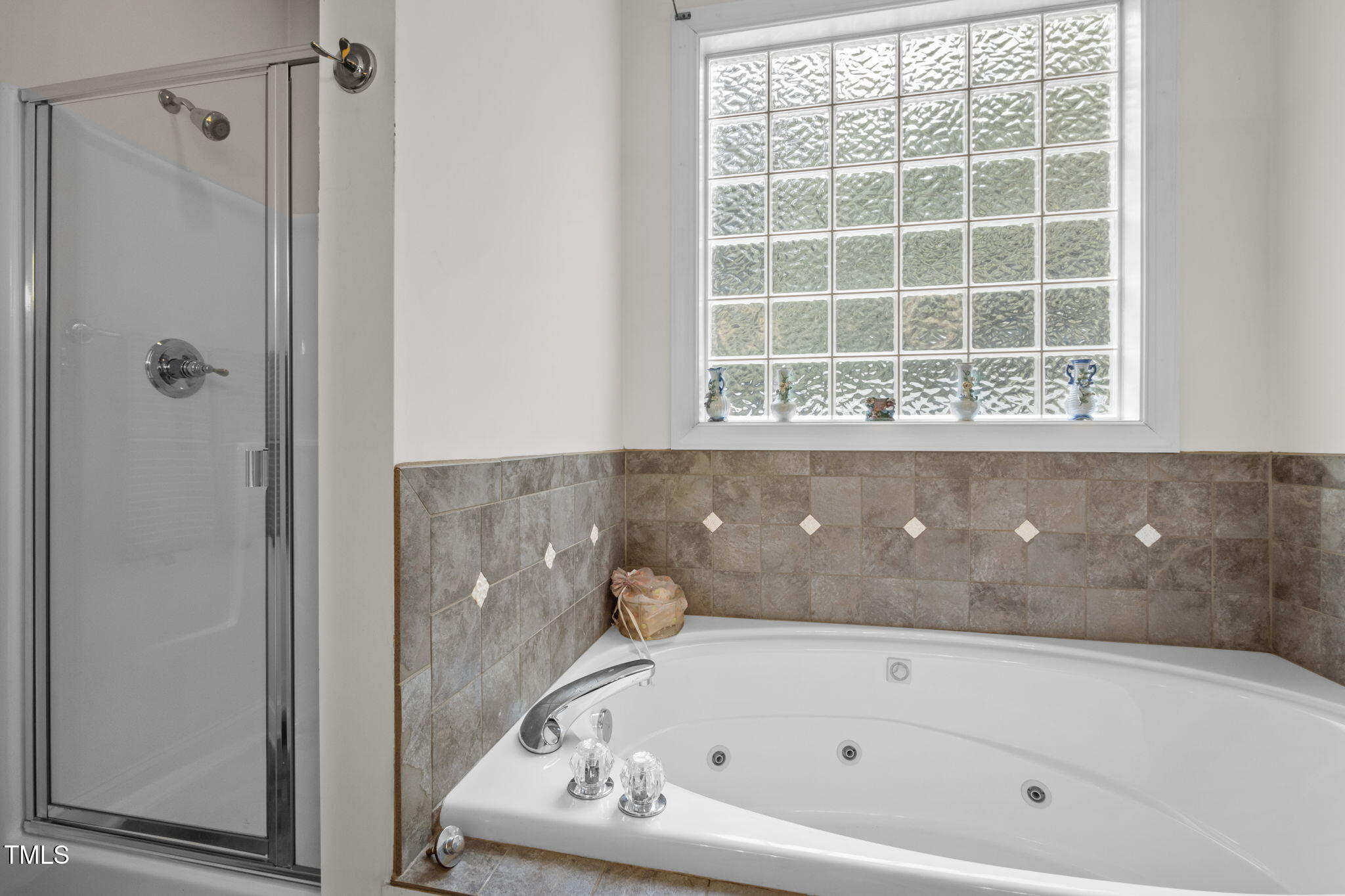 9 Piney Grove Road Bahama, NC 27503 - Photo 15 of 33 a bathroom with a bathtub