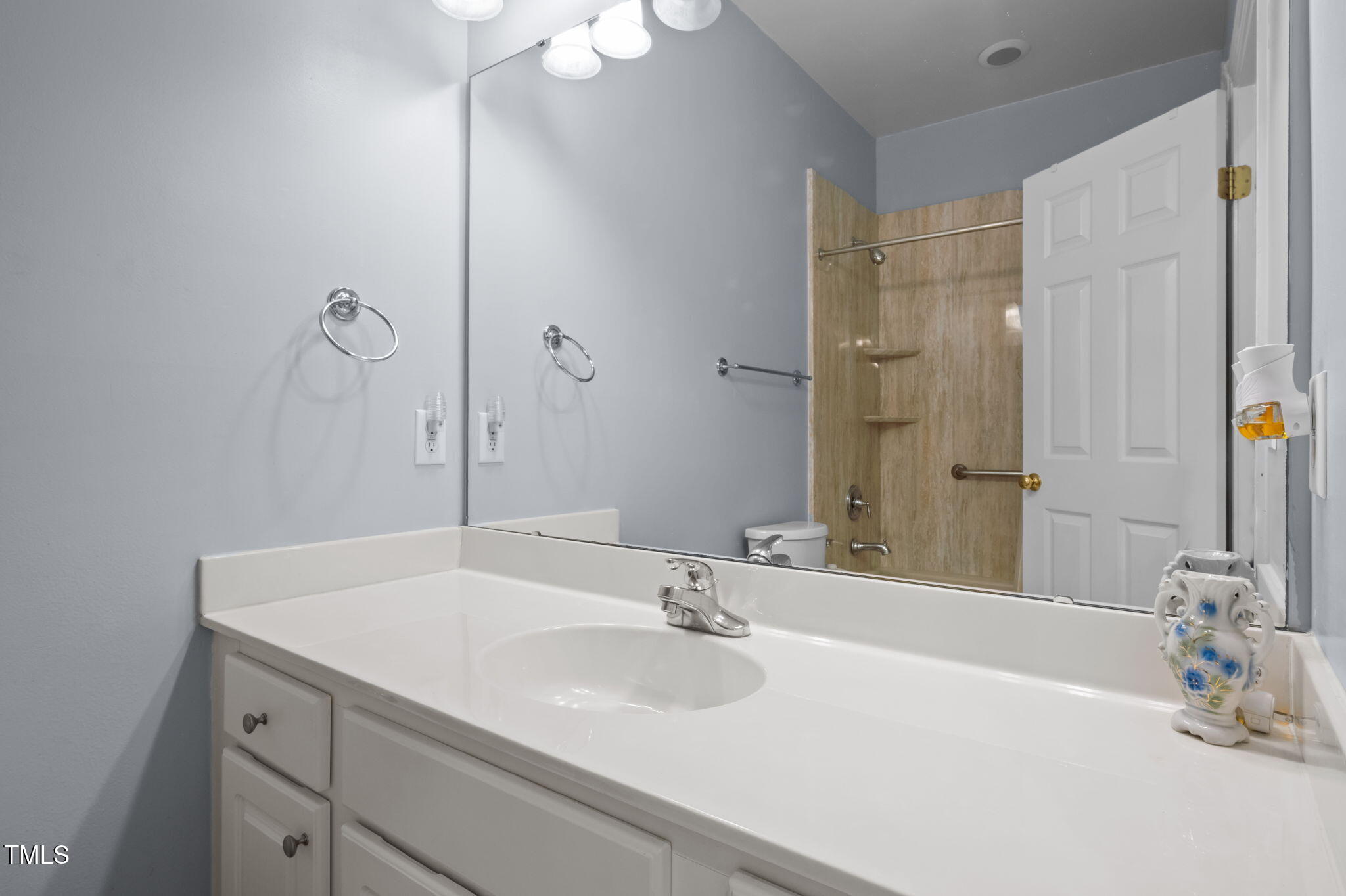 9 Piney Grove Road Bahama, NC 27503 - Photo 19 of 33 a bathroom with a sink and a mirror