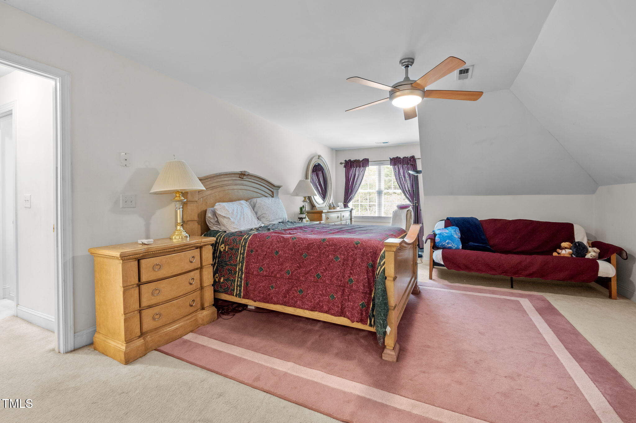 9 Piney Grove Road Bahama, NC 27503 - Photo 21 of 33 a bedroom with a bed and a chandelier