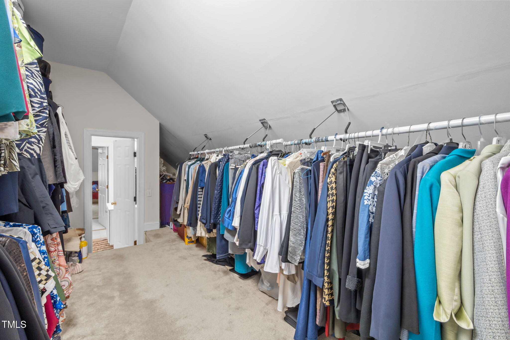 9 Piney Grove Road Bahama, NC 27503 - Photo 23 of 33 a view of walk in closet with clothes