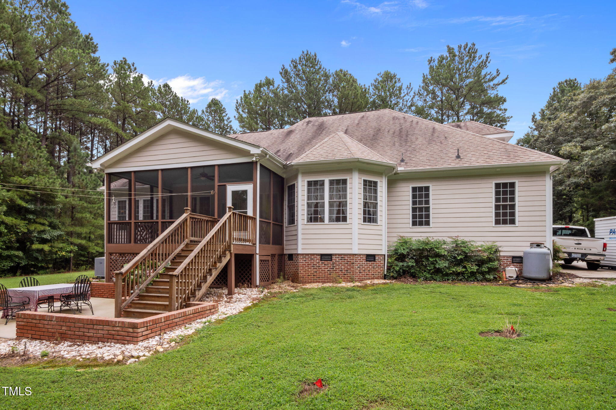 9 Piney Grove Road Bahama, NC 27503 - Photo 27 of 33 a front view of a house with a garden