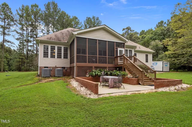 a view of a house with a yard porch and sitting area
