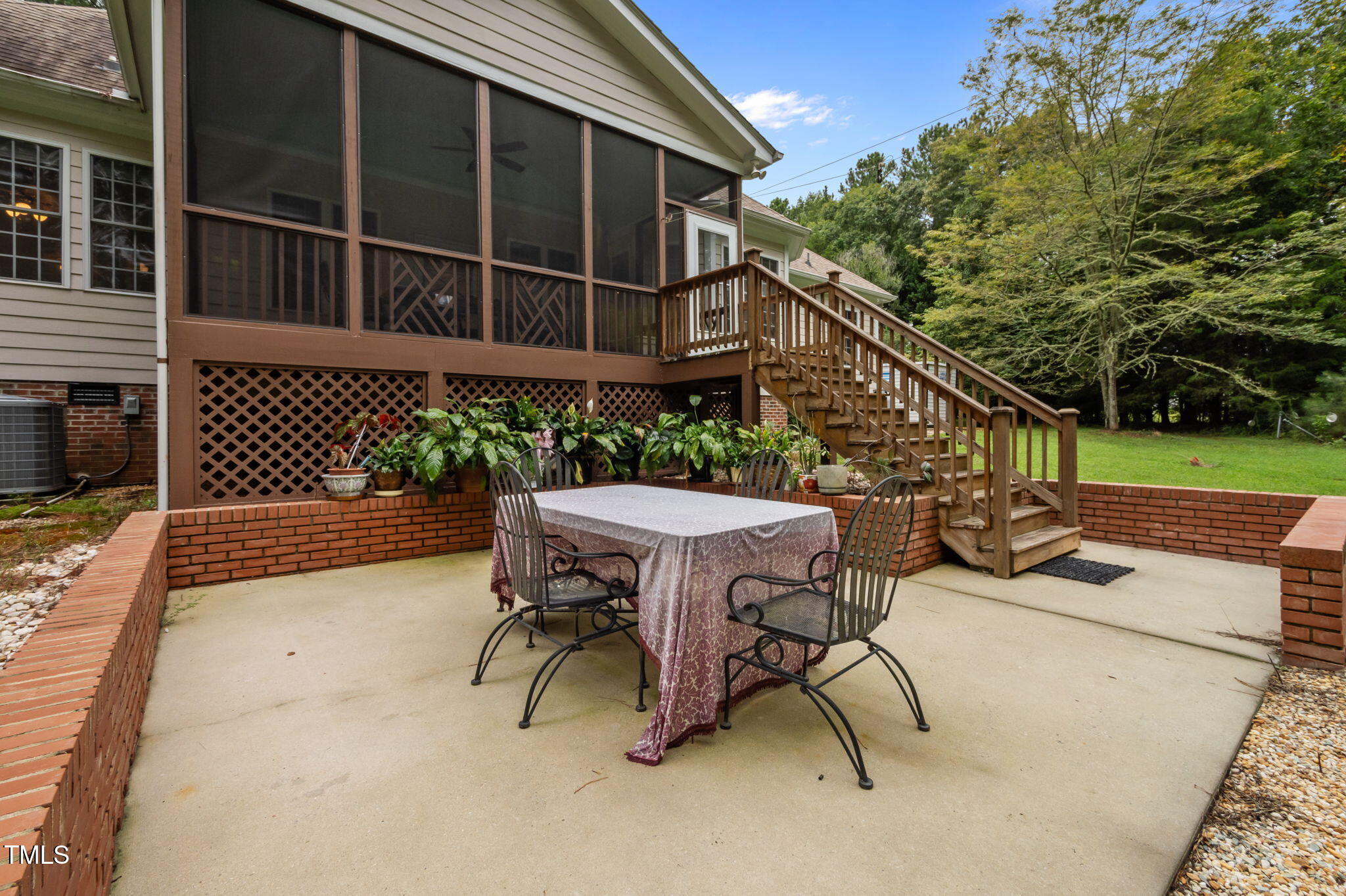 9 Piney Grove Road Bahama, NC 27503 - Photo 29 of 33 a view of backyard with table and chairs and wooden fence