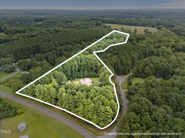 an aerial view of a golf course with a swimming pool