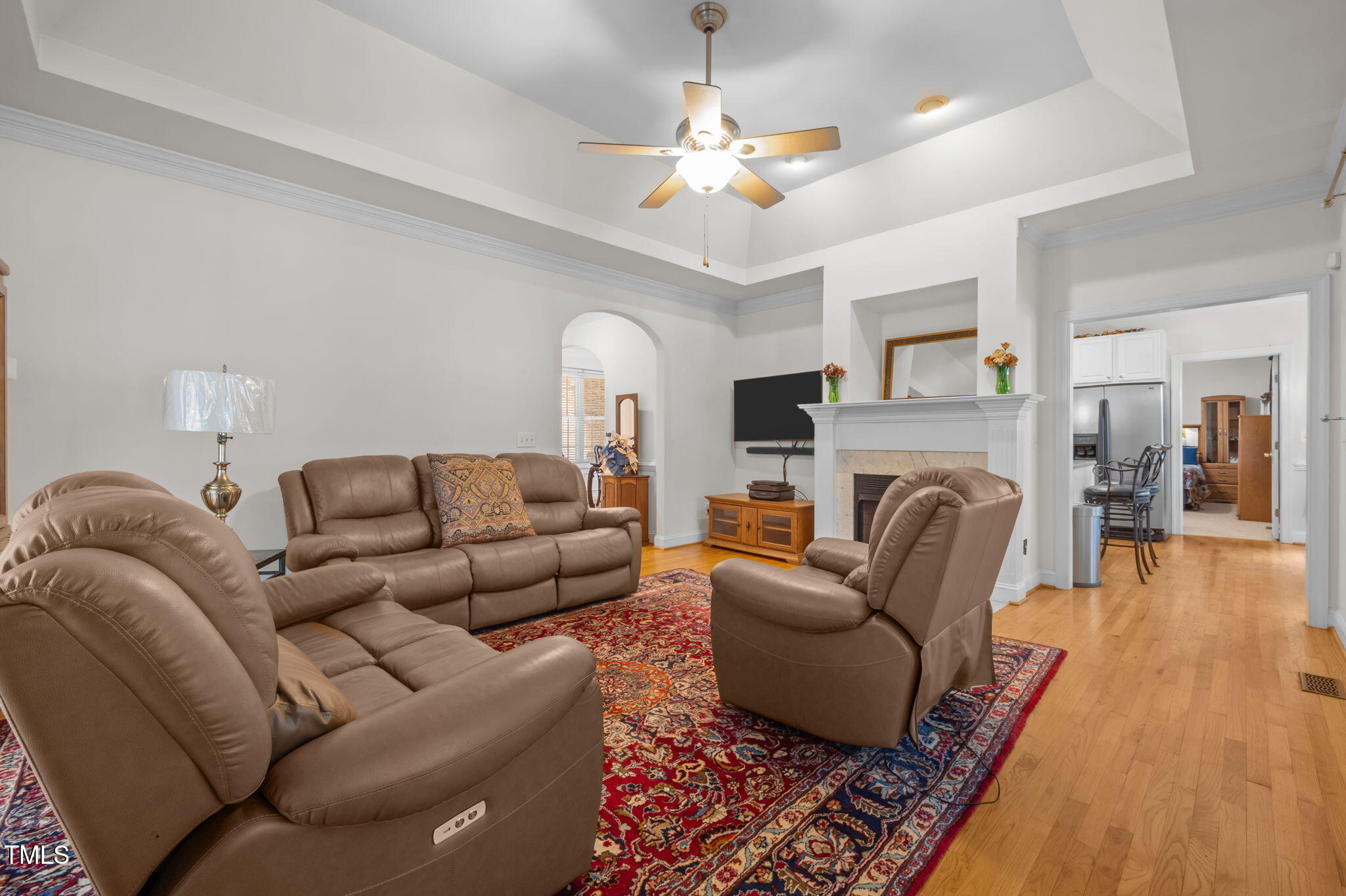 9 Piney Grove Road Bahama, NC 27503 - Photo 4 of 33 a living room with furniture a fireplace and a chandelier