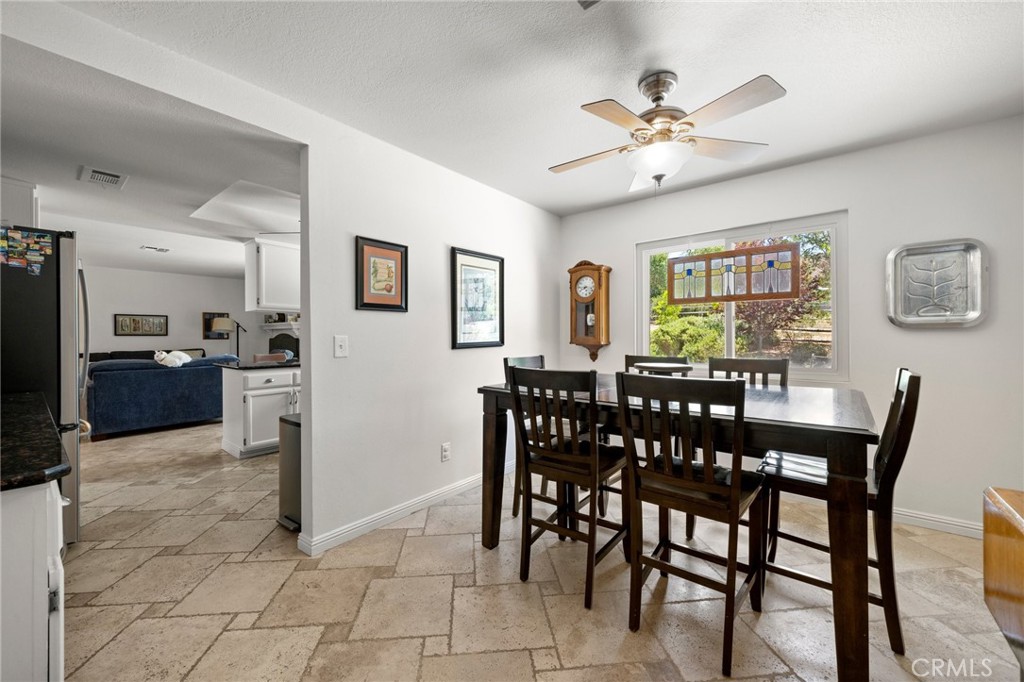 2532 Briar Glen Road Acton, CA 93510 - Photo 11 of 48 a view of a dining room with furniture and a chandelier