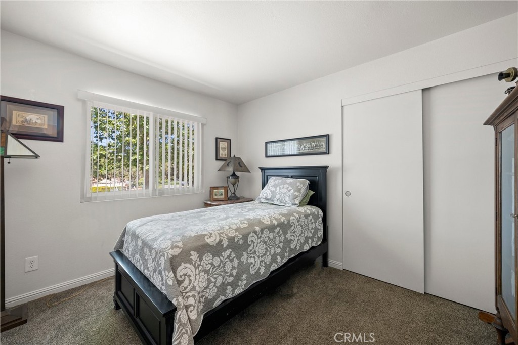 2532 Briar Glen Road Acton, CA 93510 - Photo 15 of 48 a bedroom with a bed lamp and a window