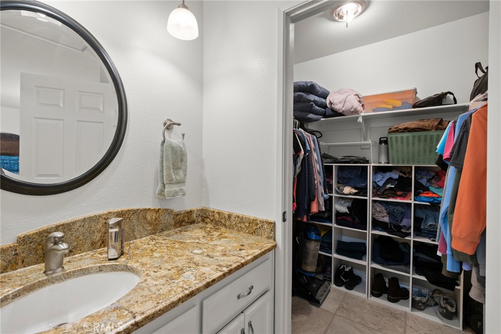 2532 Briar Glen Road Acton, CA 93510 - Photo 20 of 48 a bathroom with a granite countertop sink and a mirror