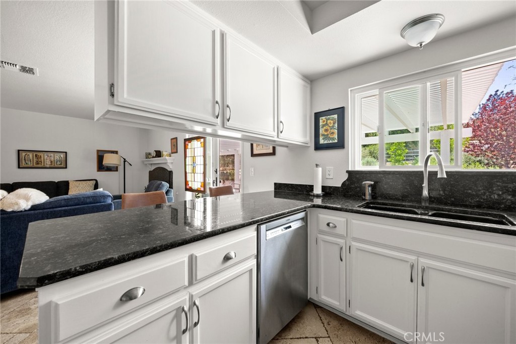 2532 Briar Glen Road Acton, CA 93510 - Photo 10 of 48 a kitchen with stainless steel appliances granite countertop a sink a stove and cabinets