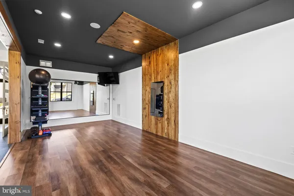 a view of a room with wooden floor