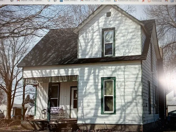 a front view of a house with glass windows