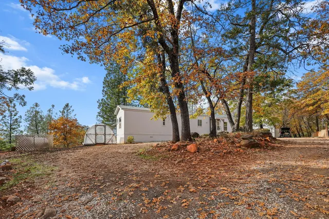 a backyard of a house with lots of green space