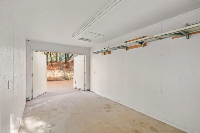 a view of a room with wooden walls