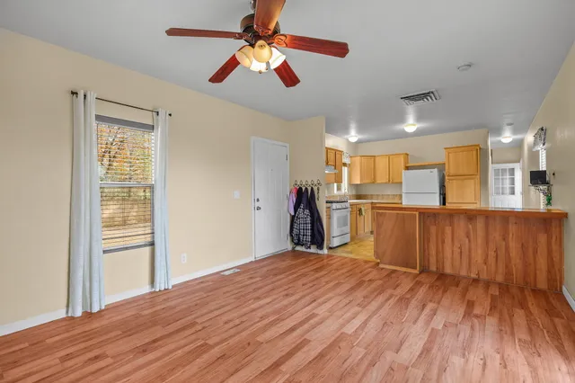 a view of a kitchen with wooden floor